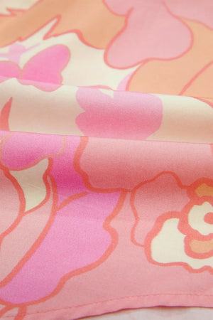 Short sleeve cotton shirt with a retro floral pattern in pink and orange hues.