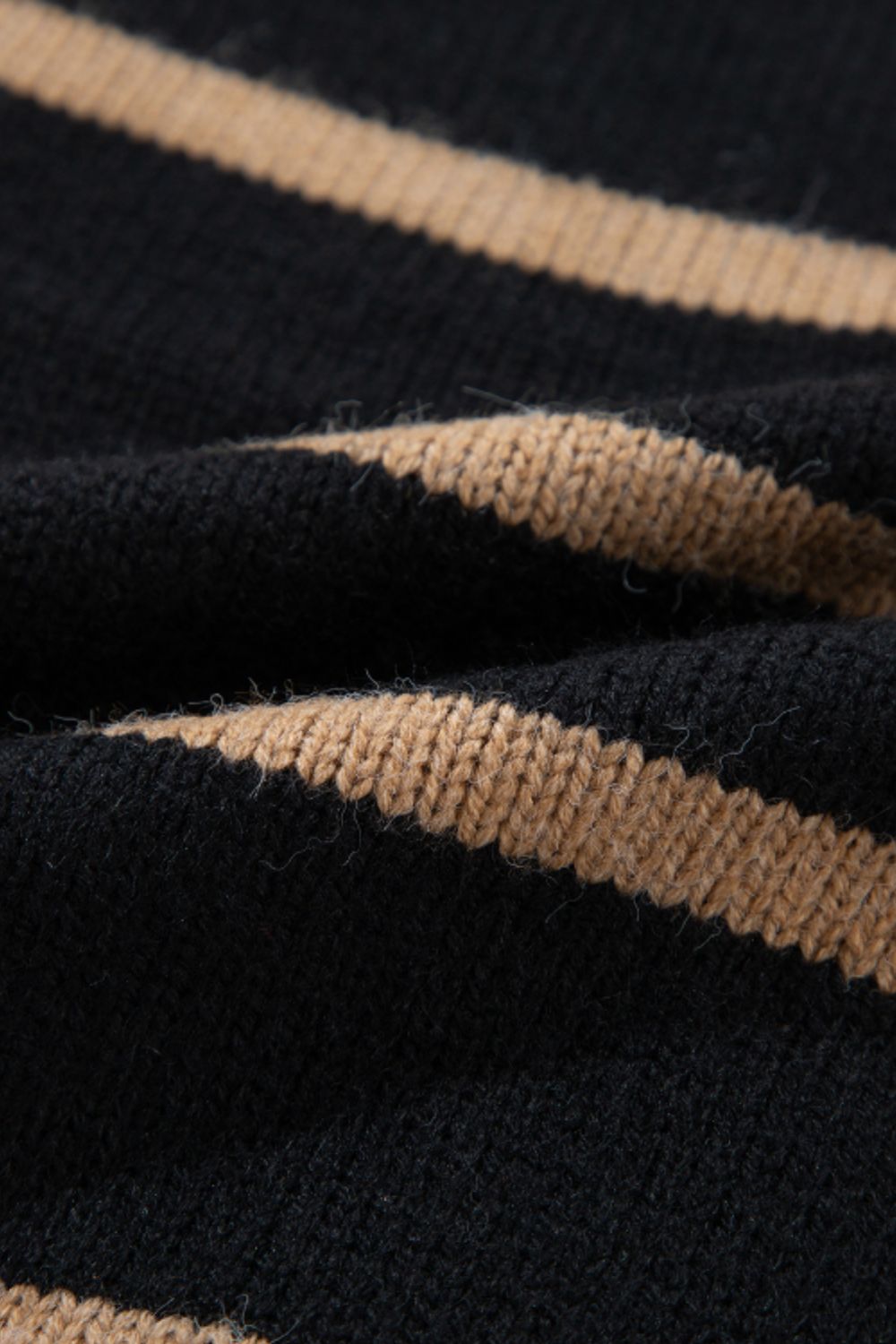 Chunky stripe button-down cardigan in black and beige acrylic knit.