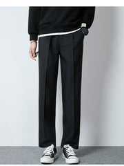 Men's black wide-leg casual pants with a relaxed fit and pleated front.