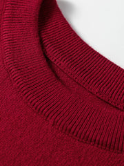 Burgundy crew neck sweater with ribbed trim and cap sleeves.