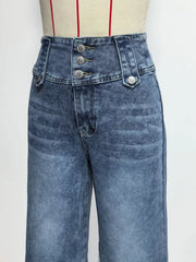 Wide-leg jeans in blue denim with a high waist and three button accents at the fly.