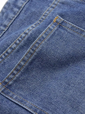 Chic high-waisted wide-leg jeans in blue denim with contrast stitching detail.