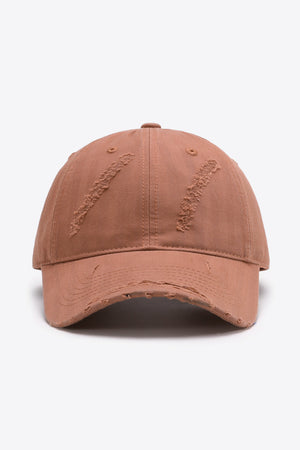 Rugged baseball cap in coral with distressed details and adjustable fit