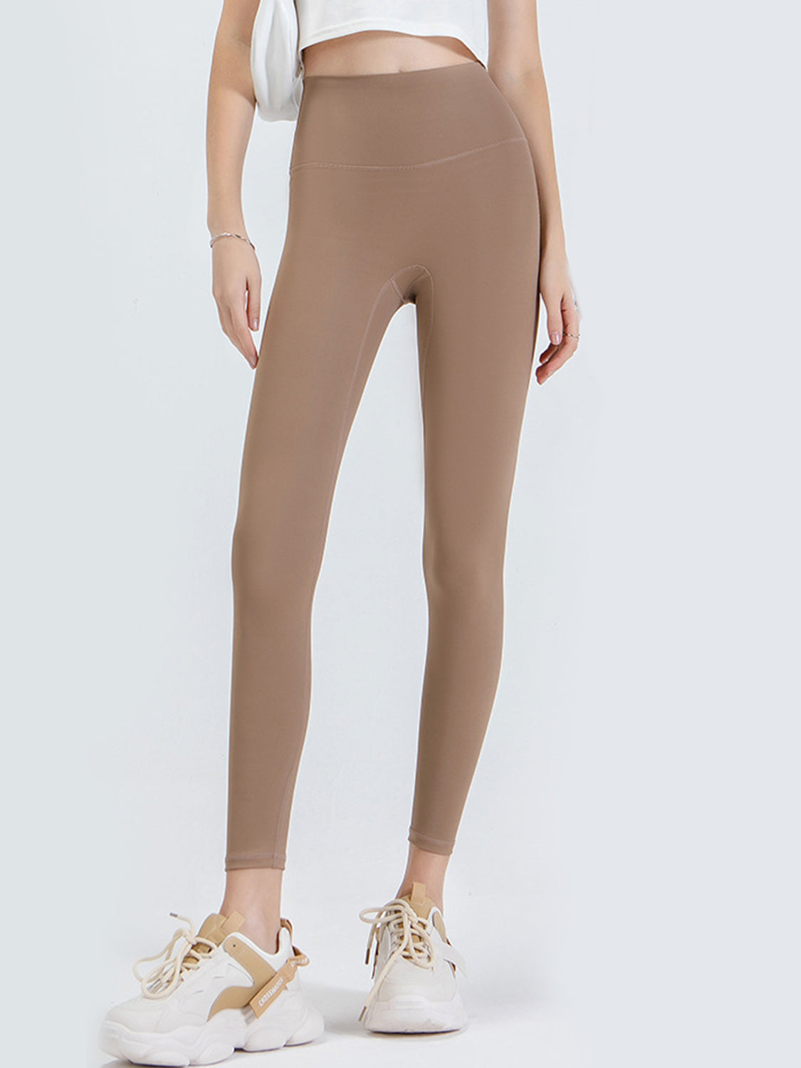 Caramel high-waist leggings with a sculpted contour fit.