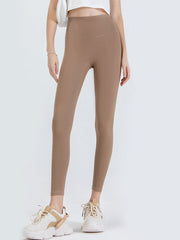 Caramel high-waist leggings with a sculpted contour fit.