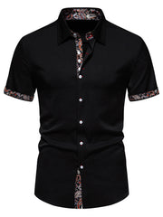 Black short sleeve buttoned shirt with paisley trim on collar, cuffs, and placket.