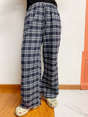 Relaxed plaid drawstring palazzo pants in dusty blue with a wide leg and front slit.