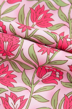 Floral print crop & A-line set fabric in dusty pink with pink blooms and green leaves.