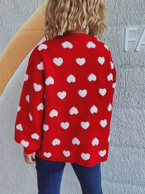 Deep Red acrylic cardigan with all-over white textured heart motif.