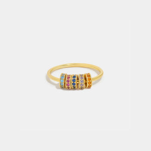 Gold pavé band ring with multicolor gemstone accents