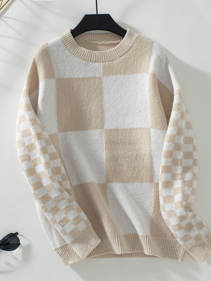 Checkerboard knit sweater in tan and white with crew neck and long sleeves.