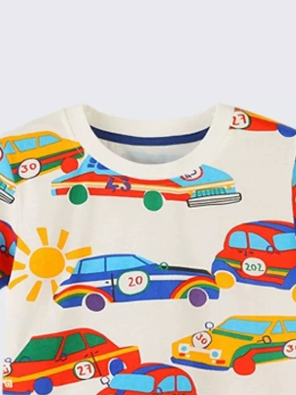 Toddler t-shirt in cream with a playful racing car print and sun graphic, cotton.