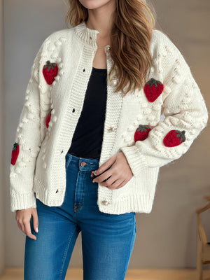 Beige knit cardigan with strawberry patches and pearl buttons.