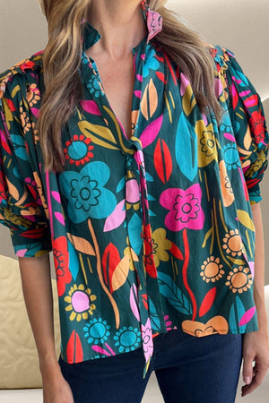 Botanical ruffle-sleeve tie-neck blouse in floral print with a deep V-neckline.