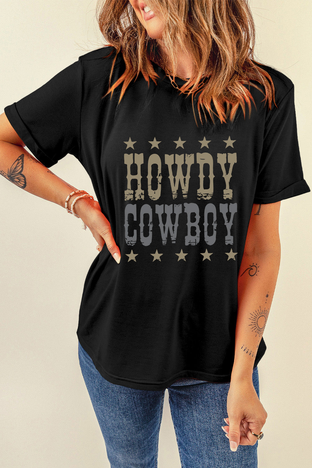 Black t-shirt with "Howdy Cowboy" graphic and stars.