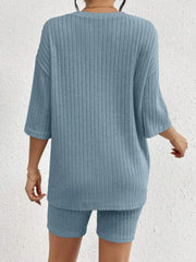 Light blue ribbed loungewear set with relaxed fit top and biker shorts.
