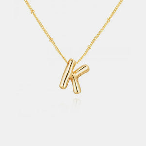 Gold initial K charm necklace with beaded chain