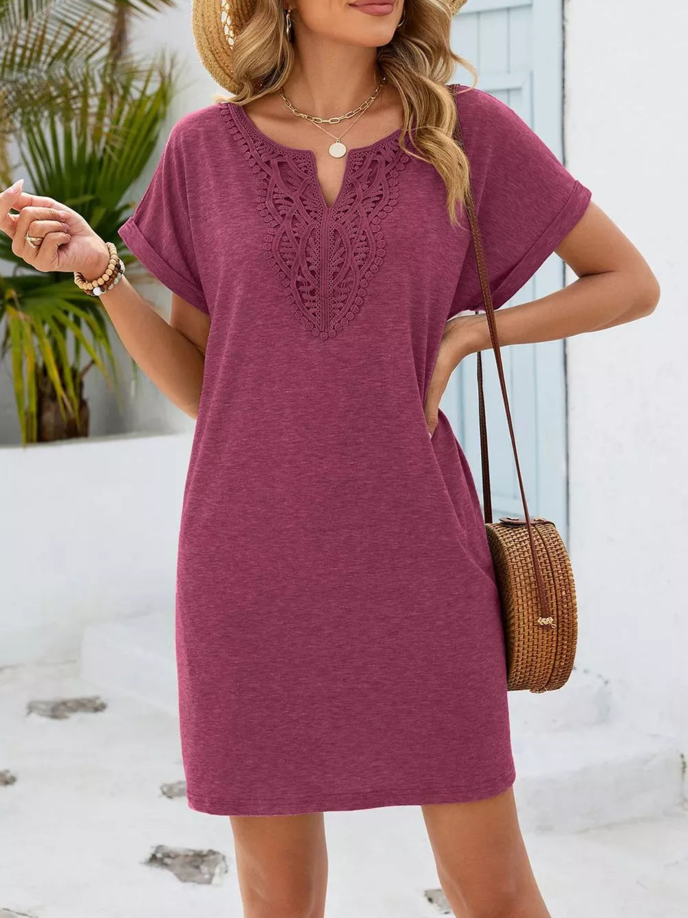 Deep purple V-neck dress with lace inset detail and short sleeves.