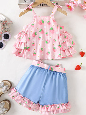 Strawberry print cami with tiered ruffles and bow straps paired with blue denim shorts with ruffled strawberry trim.
