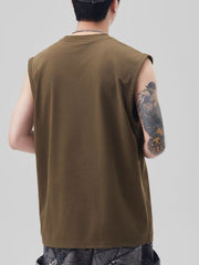 Men's oversized cotton tank top in caramel, showing the back view.
