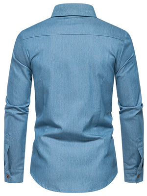Light blue cotton denim shirt with button cuffs and functional pockets.