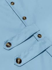 Light blue cotton men's long-sleeve shirt with button details and tortoise shell buttons.