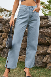 Light wash denim jeans with a straight leg and split hem detail.