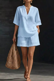 Light blue notched top and pocketed shorts set with V-neck and short sleeves.