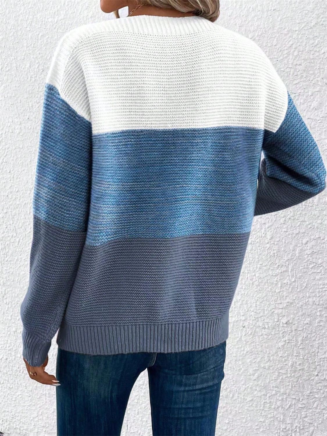 Colorblock boatneck knit sweater in white, blue, and gray acrylic with horizontal stripes.