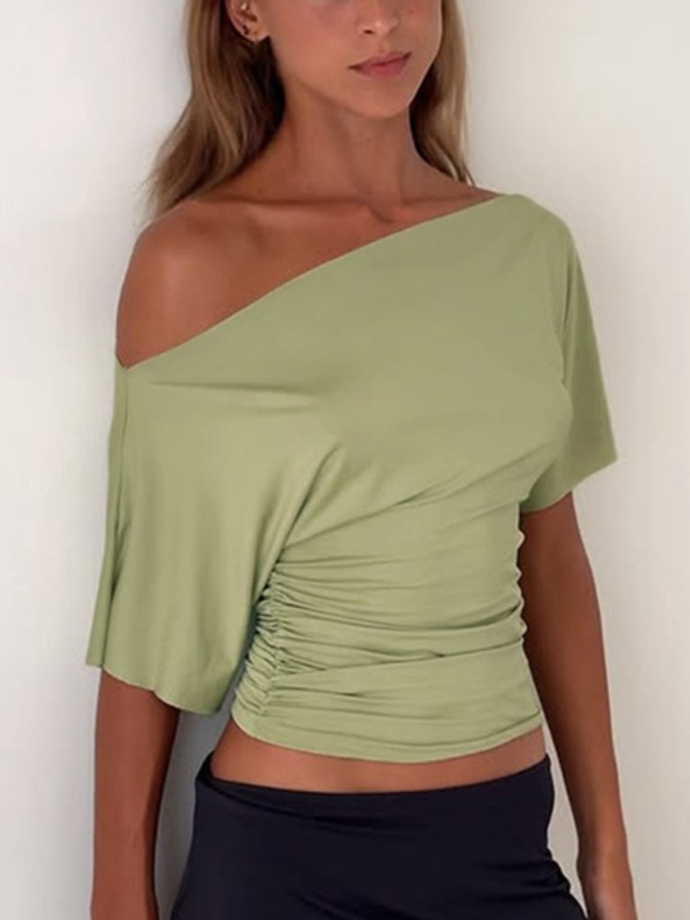 Sage ruched one shoulder t-shirt with asymmetrical neckline and short sleeves.