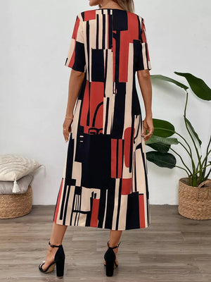 Geometric v-neck midi dress in abstract print with short sleeves and a flowy skirt.