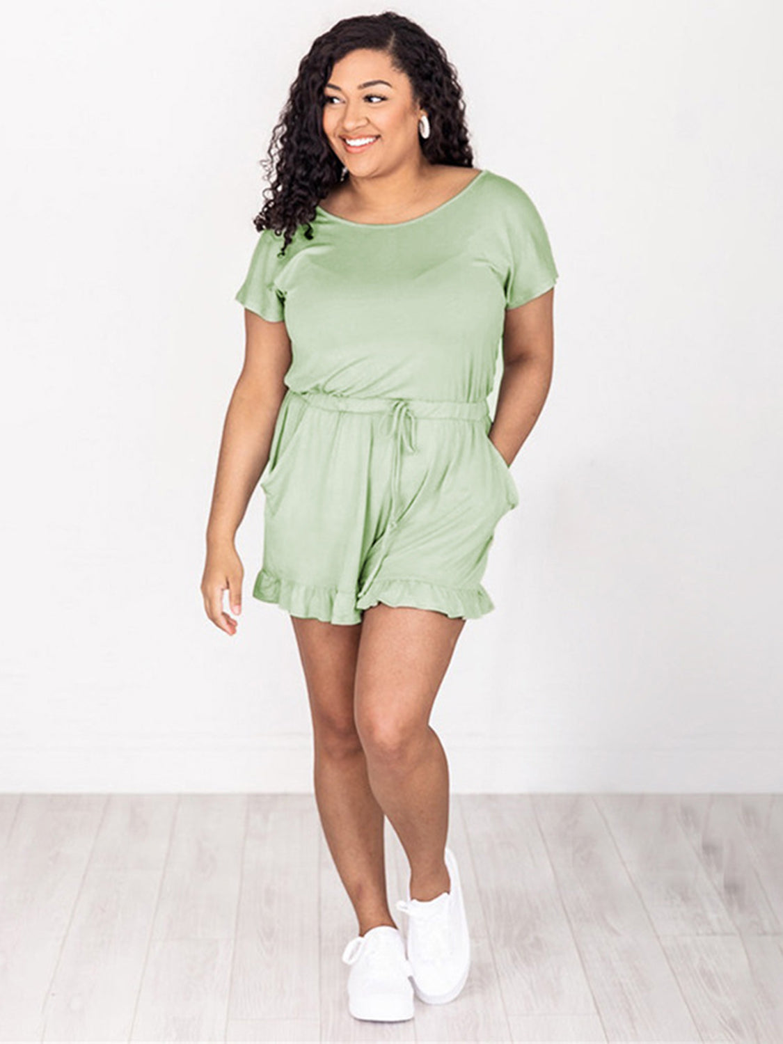 Gum Leaf off-shoulder romper with ruffle hem and drawstring waist.