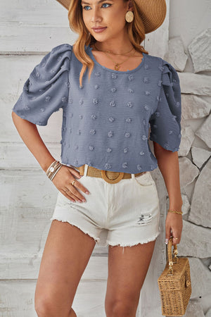 Dusty Blue textured puff-sleeve blouse with pom-pom details and scoop neckline.