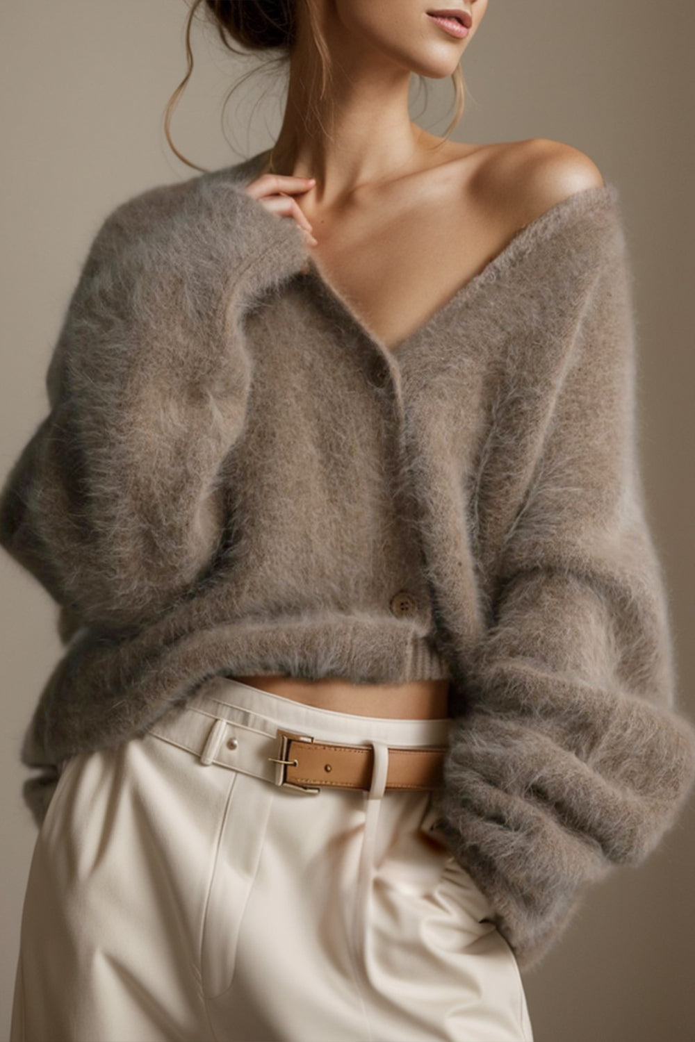 Fluffy angora V-neck cardigan in dark gray with button closure and relaxed fit.