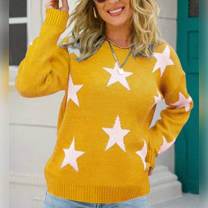 Yellow acrylic crewneck sweater with white and pink stars, long sleeves.