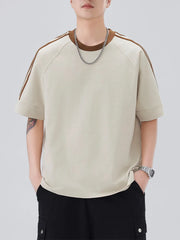 Oversized t-shirt in apricot with contrast stitching on sleeves and neckline.