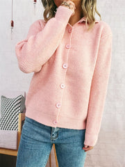 Pink ribbed button-up cardigan with polo collar and matching buttons.