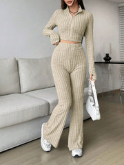 Khaki ribbed knit flare co-ord set with zip-up crop top and high-waisted pants.