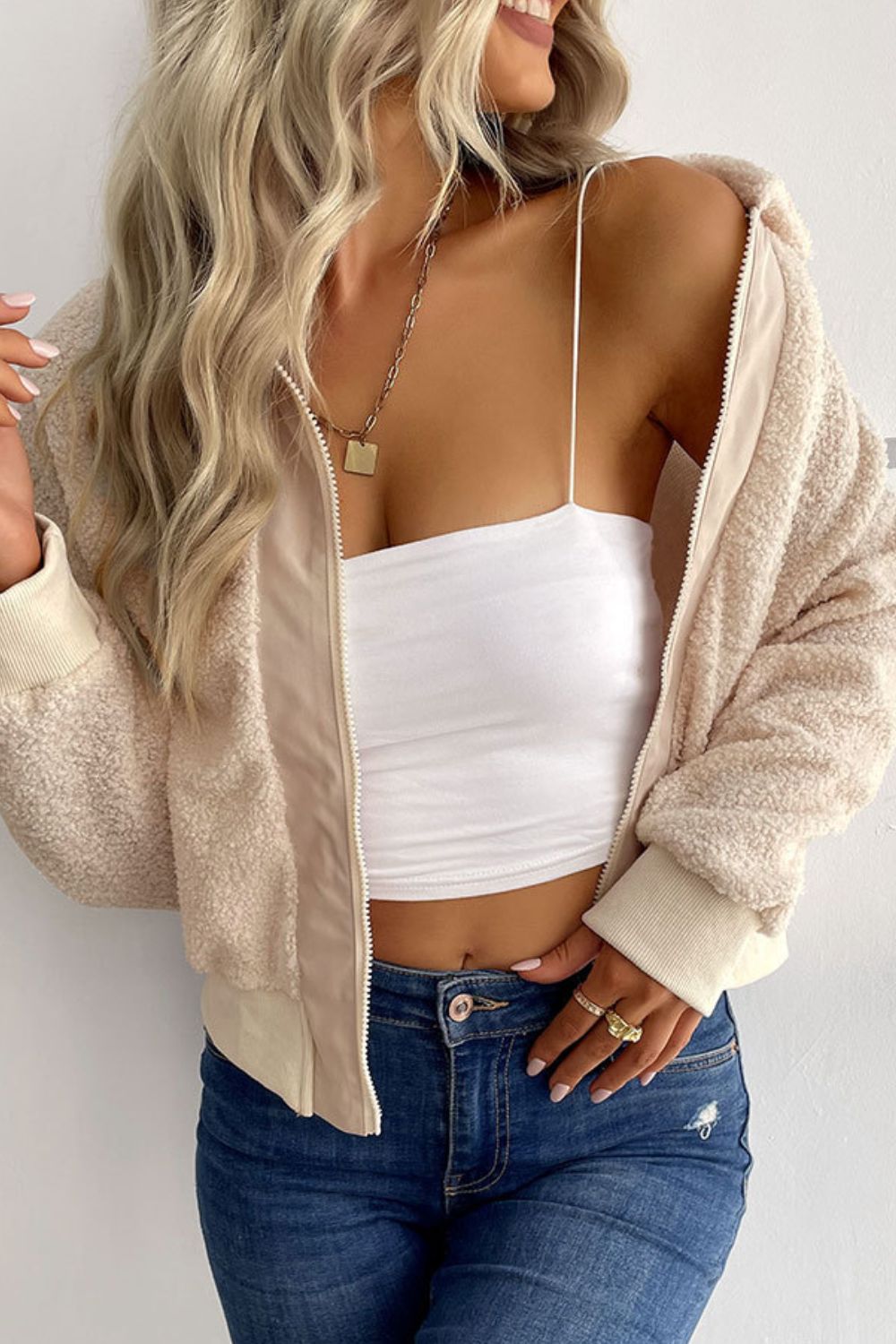 Cream teddy fleece bomber jacket with collared neck and zip front.