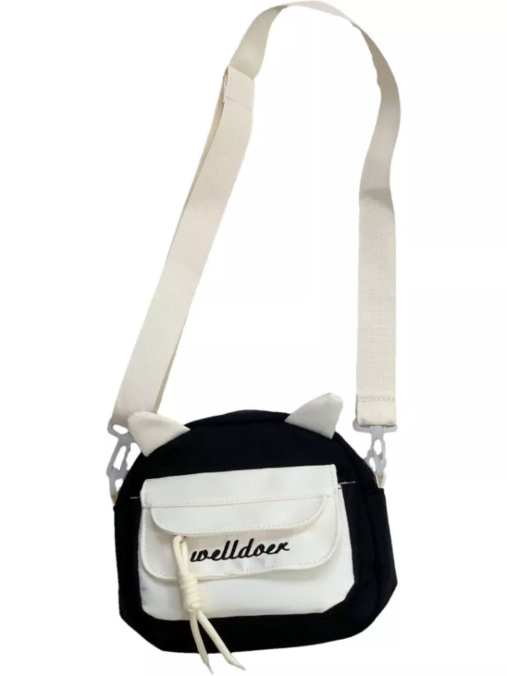 Black crossbody bag with white accents, cat ears, and adjustable strap.