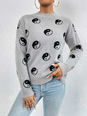 Heather gray knit sweater with all-over black yin yang pattern, drop shoulders, and crew neck.