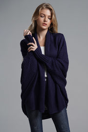 Dark blue acrylic cocoon knit sleeve cardigan with open front and ribbed cuffs.