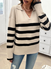 Tan knit polo sweater with bold black stripes and a v-neck.