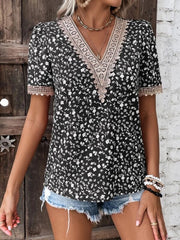 Black floral V-neck blouse with lace trim and short sleeves