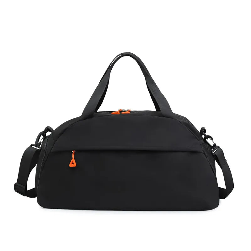 Black duffel bag with orange zipper accents and detachable strap