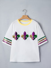 White maternity t-shirt with sequin fleur-de-lis and striped sleeves.