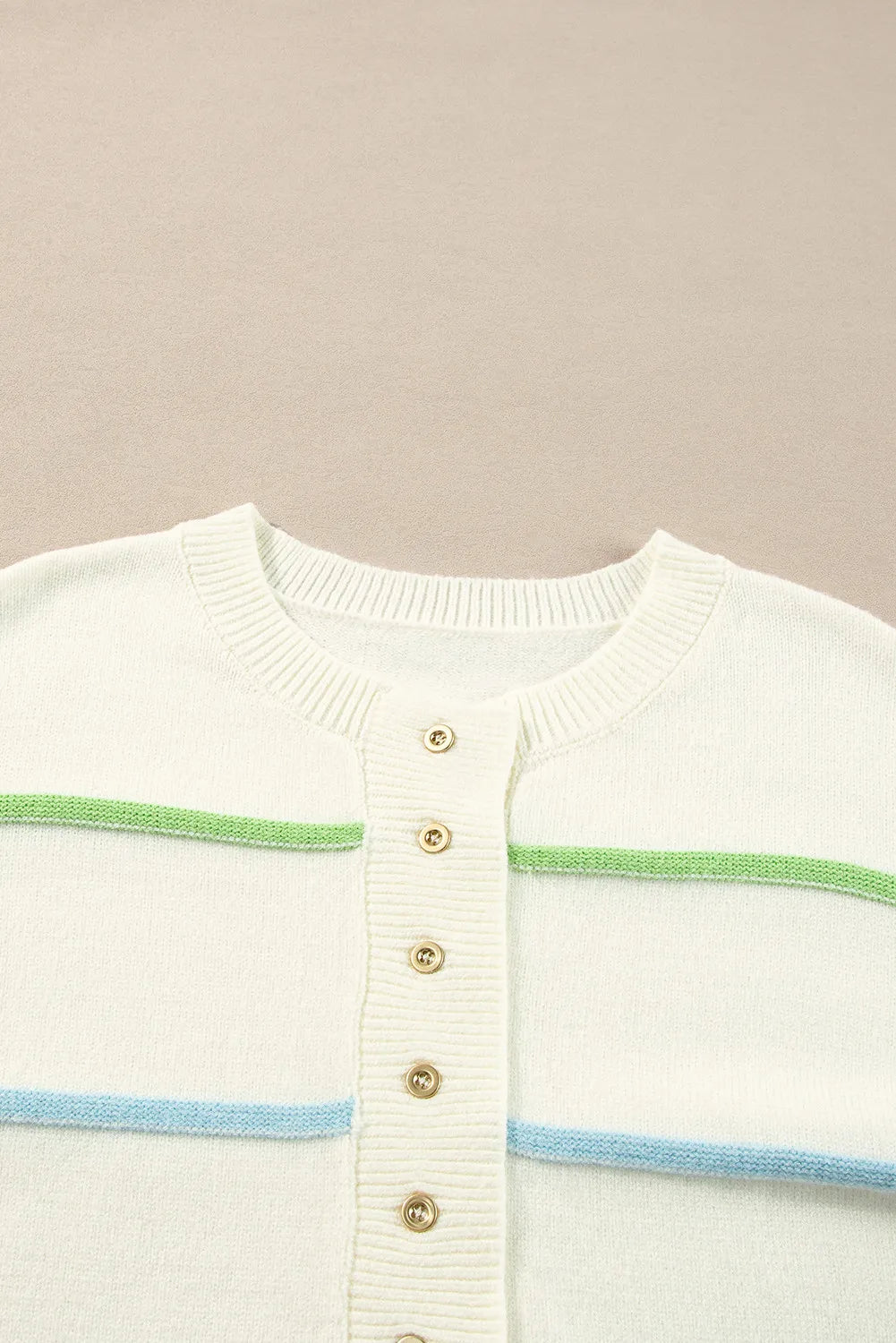 Ivory knit cardigan with pastel green and blue stripes and gold buttons