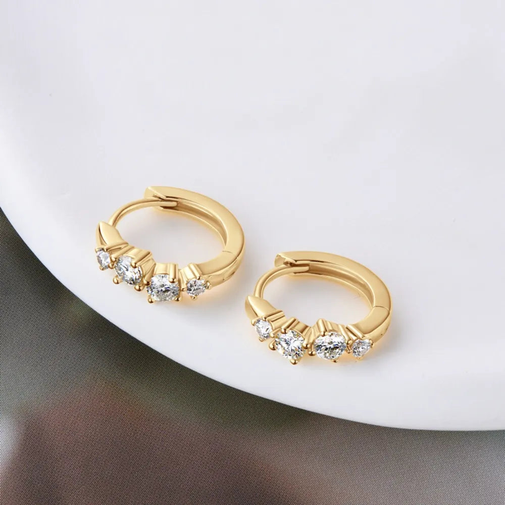 Gold mini hoop earrings with pavé crystal embellishments
