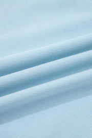 Light blue cotton bikini fabric with textured weave and soft folds.