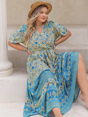 Bohemian floral maxi dress with tie waist, v-neck, short sleeves, and blue border print.